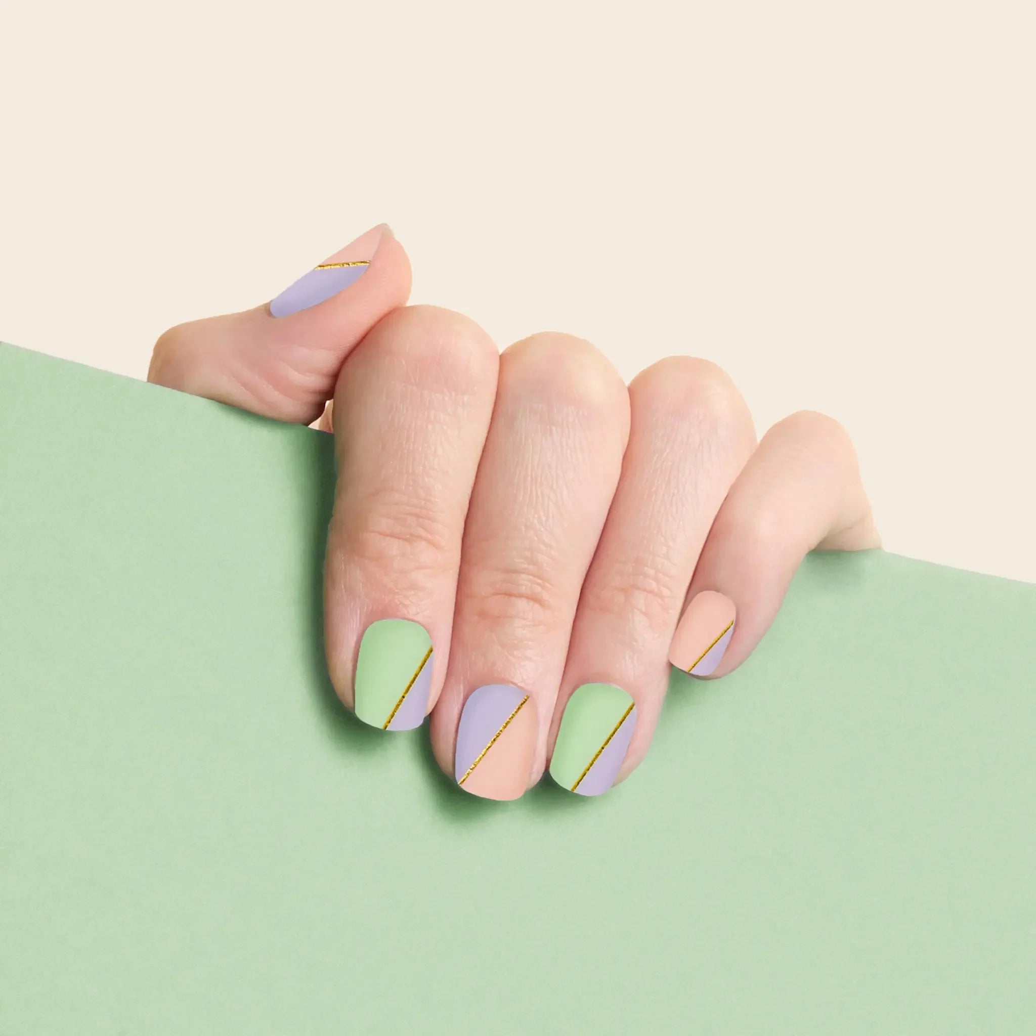 mesme Katya Pastel Gold 3+ Day UV-Free Gel Nail Wraps On Hand