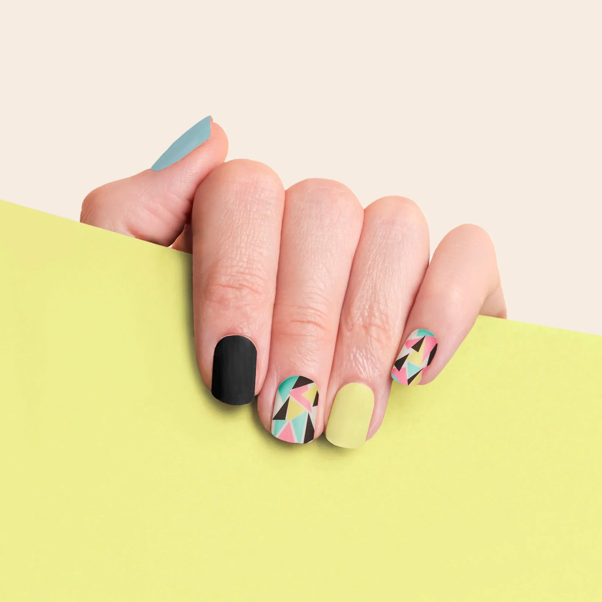 mesme Risa Black, Pastel Yellow, Sky Blue 3+ Day UV-Free Gel Nail Wraps On Hand