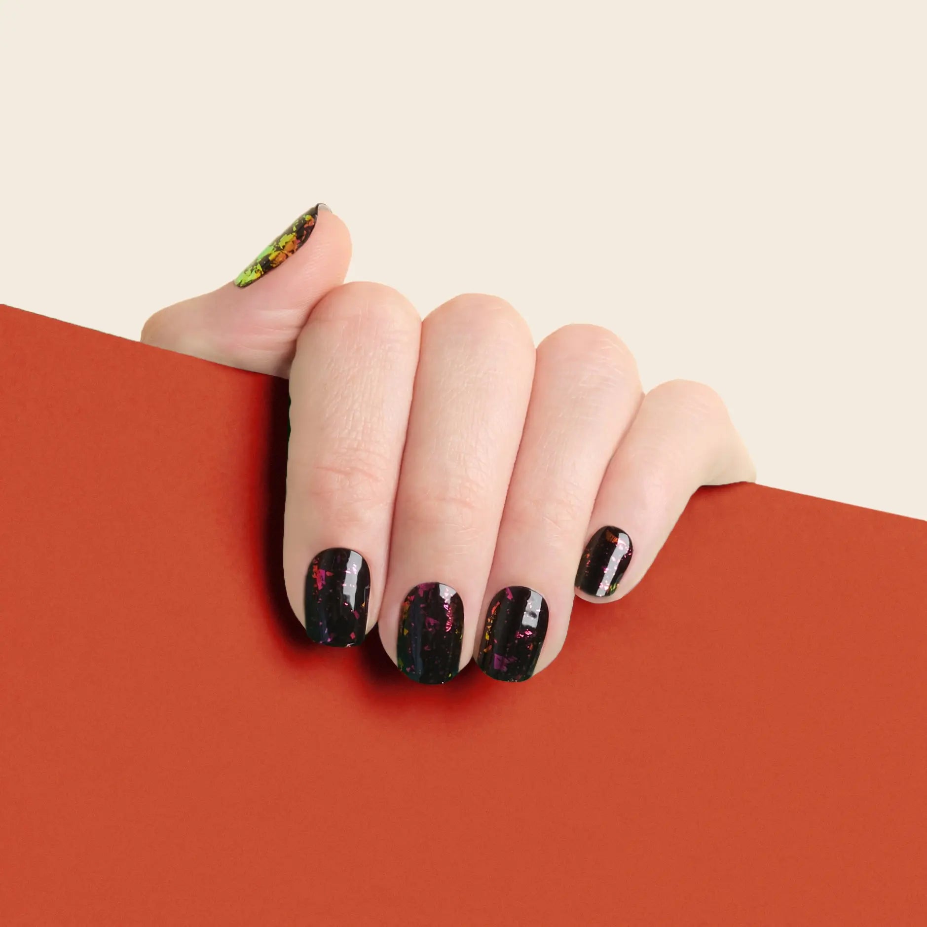 mesme Simone Black & Red Foil 14-Day UV Gel Nail Wraps On Hand