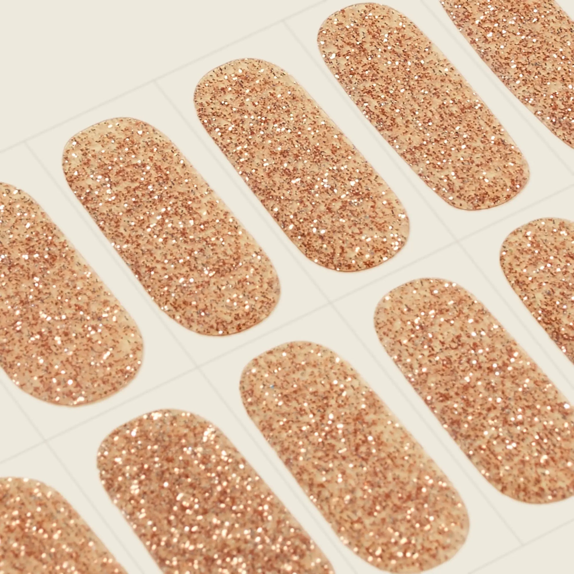 mesme Therese Gold Glitter 10-Day UV-Free Nail Wraps — Strip Sheet Close-Up